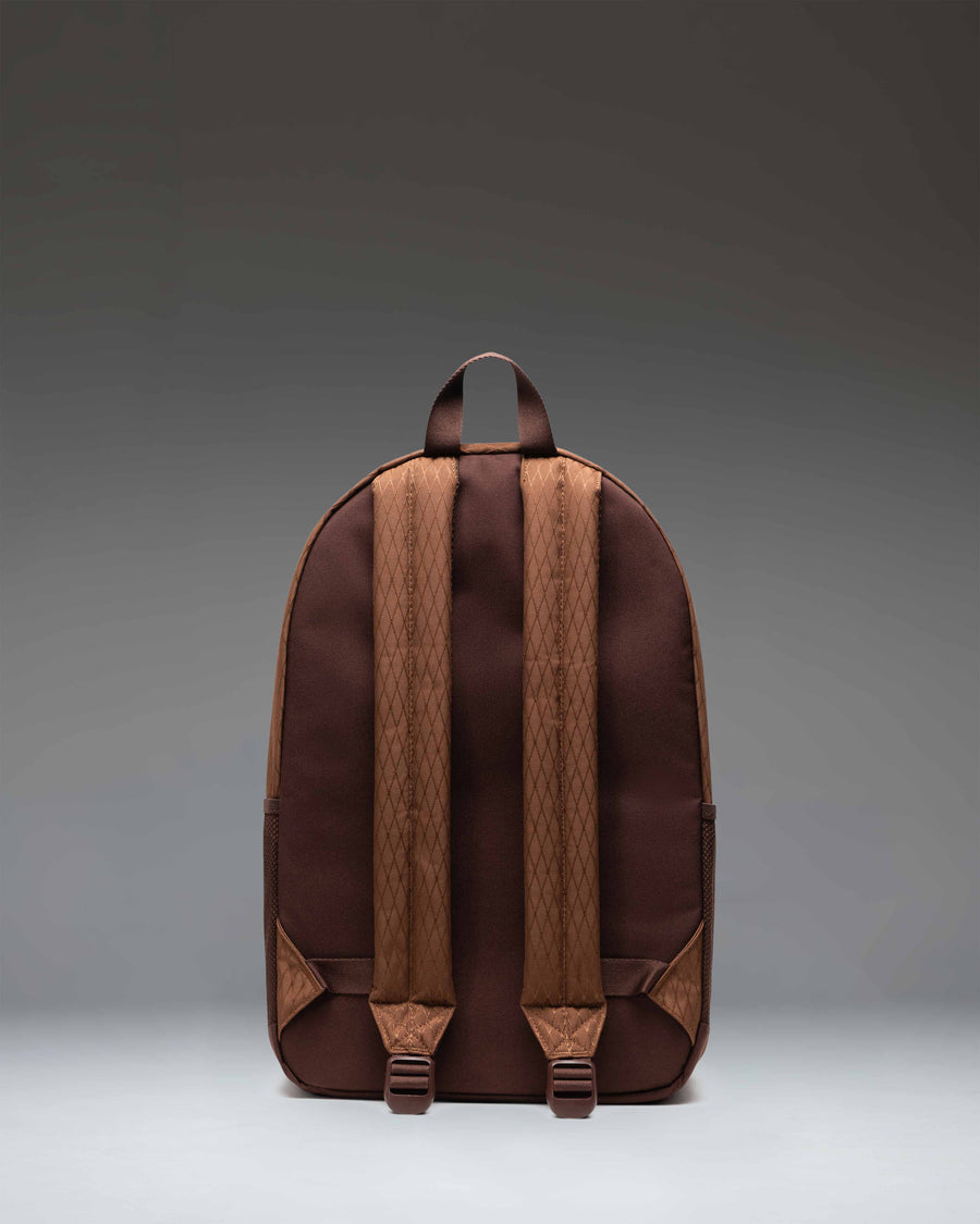 Herschel Supply Co. Kaine Backpack in Soft Silt Diamond and Chicory Coffee brown, showing the front view with pockets and straps.