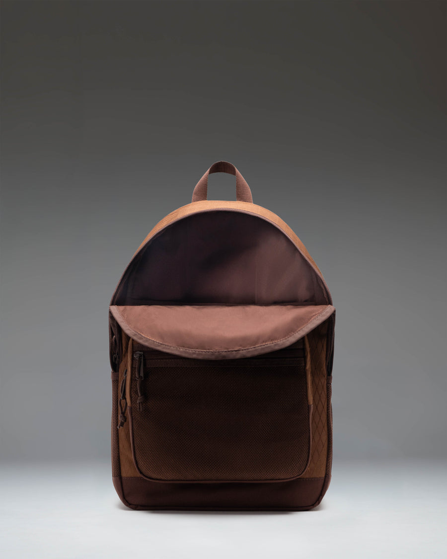 Herschel Kaine Backpack in Soft Silt Diamond and Chicory Coffee colorway with mesh front pocket, water bottle holders, and adjustable straps.