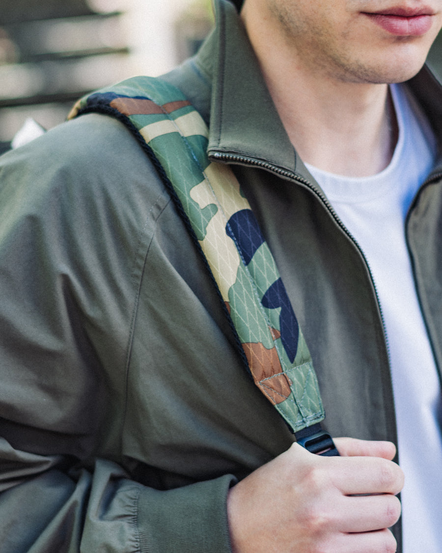 Herschel Supply Co. Kaine Backpack, multi-color front view with a rounded top and knotted cord pulls.