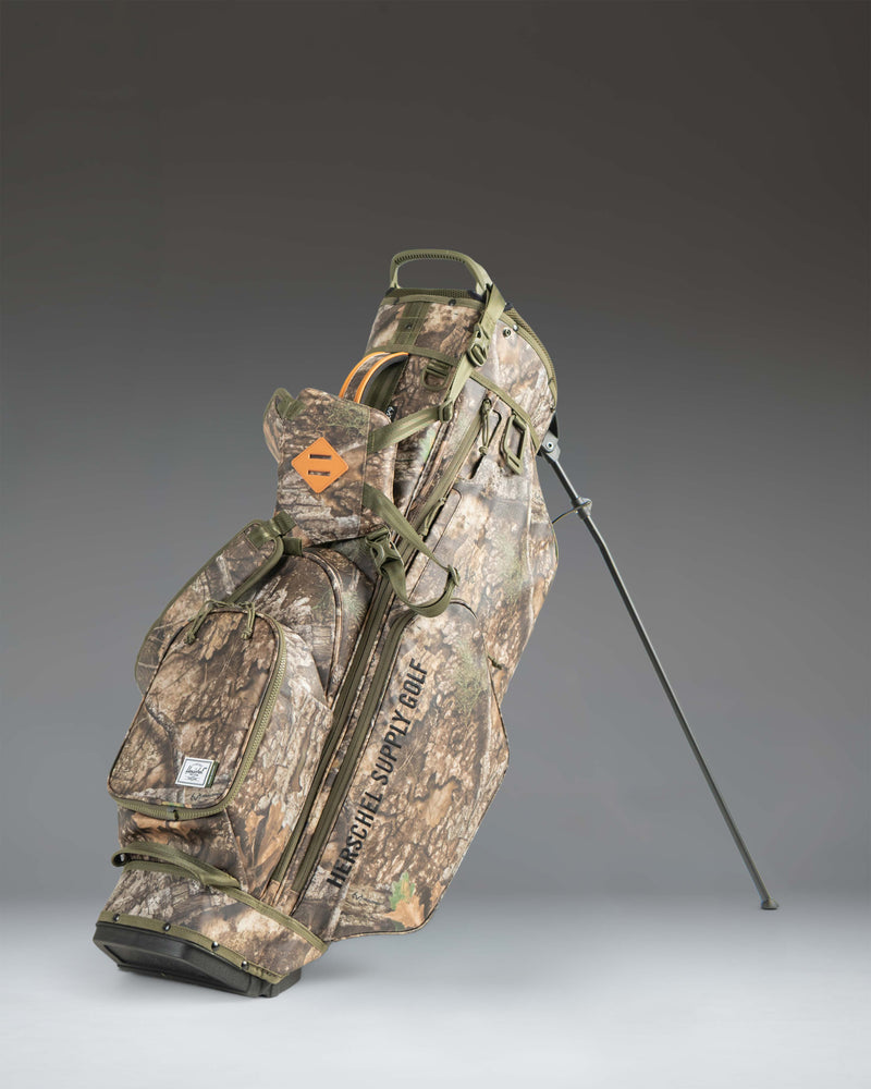 Realtree Herschel Watt Stand Bag in Realtree APX Camo print.
