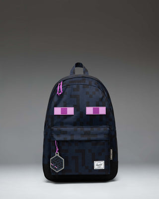 Herschel Supply Co. x Minecraft Enderman backpack featuring the iconic pixelated Enderman character eyes on a black background.
