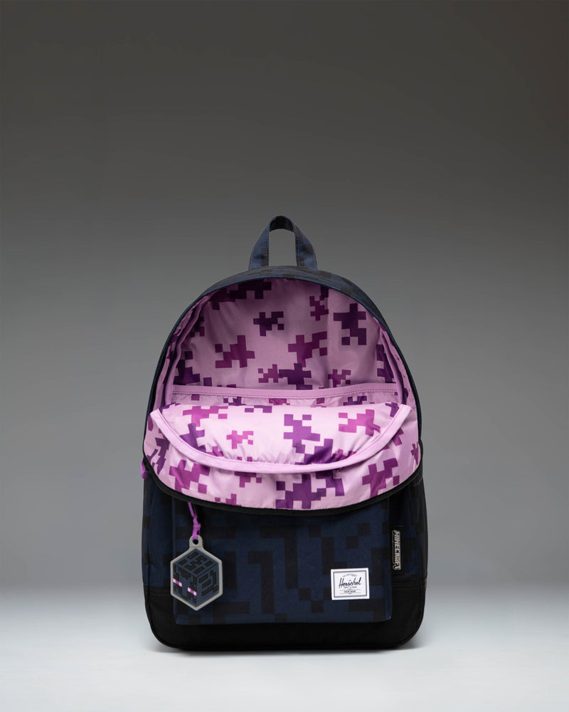 Herschel Supply Co. x Minecraft limited-edition Enderman backpack featuring the pixelated purple eyes of the character.