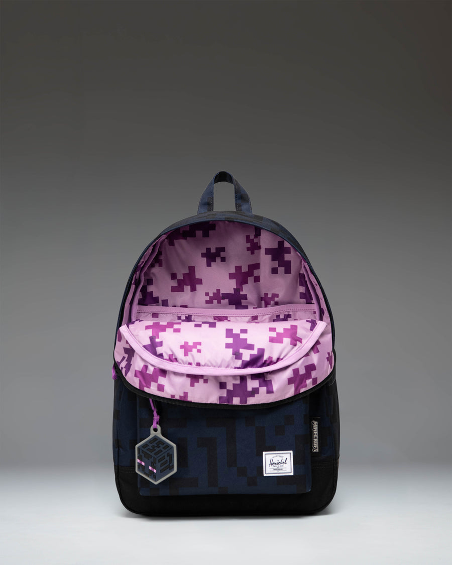Herschel Supply Co. x Minecraft limited-edition Enderman backpack featuring the pixelated purple eyes of the character.