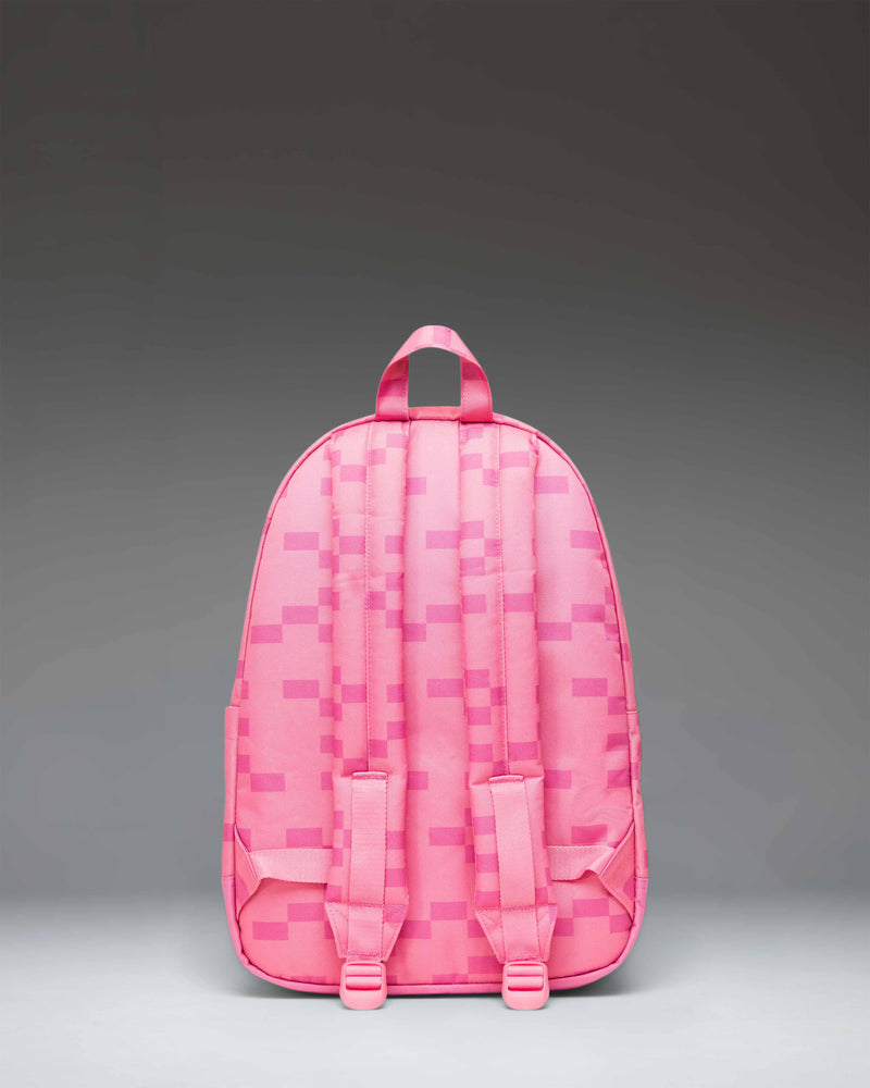 Herschel Supply Co. casual backpack in a soft light pink shade featuring a minimalist design with a front zippered pocket and woven logo patch.
