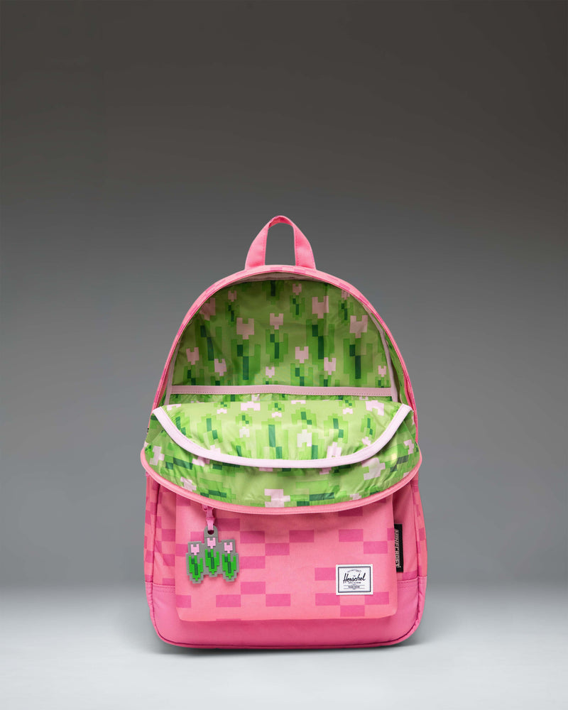 Herschel Supply Co. product in Pink Sheep colorway, featuring a solid pattern and classic functional design suitable for travel or casual use.