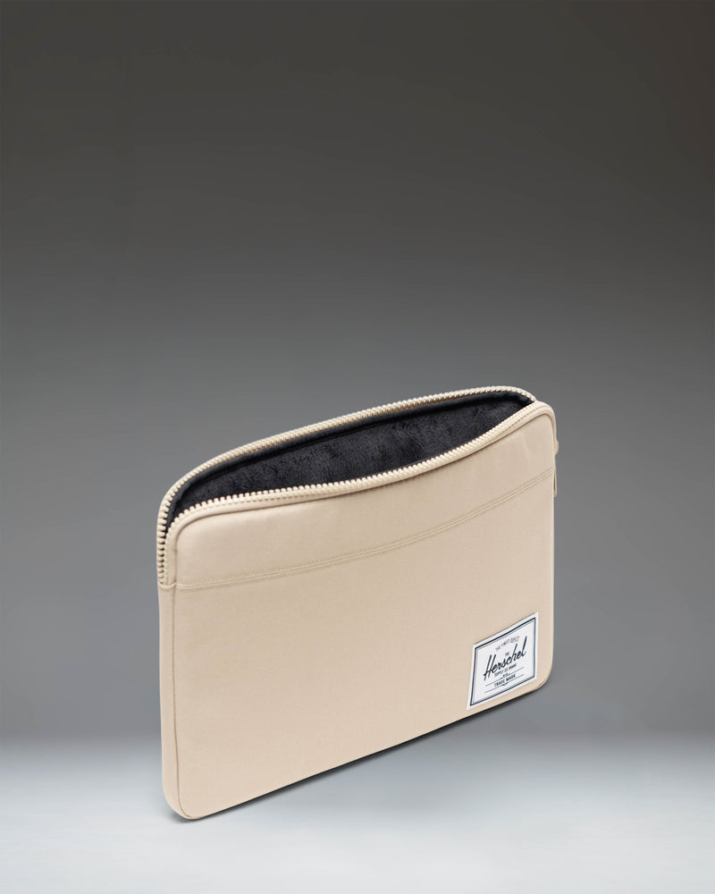 Herschel Supply Co Anchor 14 Inch Sleeve in Eucalyptus green color shown from a flat front view.