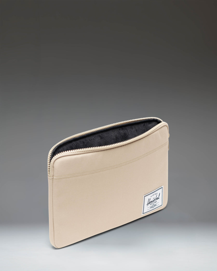 Herschel Supply Co Anchor 14 Inch Sleeve in Eucalyptus green color shown from a flat front view.
