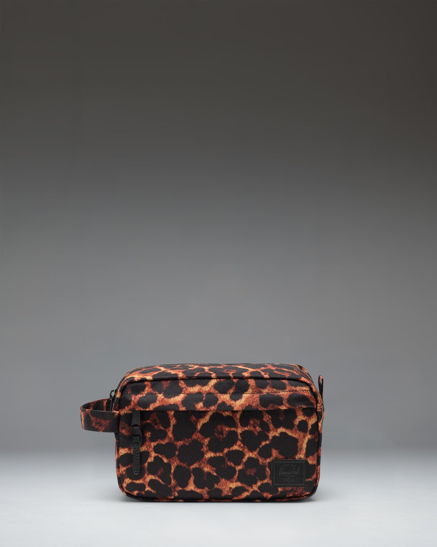 Herschel Supply Co. Chapter Travel Kit in Digi Leopard print, featuring a black leopard spot pattern on a grey background.