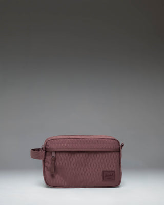 Herschel Supply Co. Chapter Travel Kit toiletry bag featuring the Huckleberry Diamond geometric pattern with a side handle and front pocket.