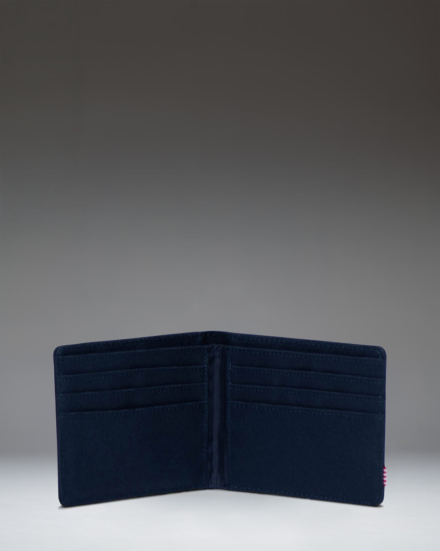 Herschel Supply Co. Roy Wallet in navy blue, showcasing its classic bi-fold design and durable fabric.
