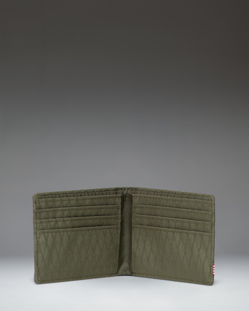 Herschel Supply Co Roy Wallet in Ivy Green Diamond, shown opened up to reveal the interior slots and billfold.