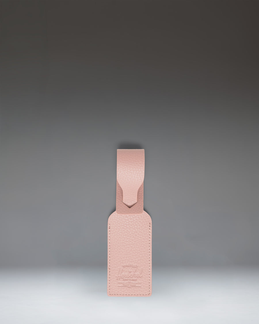 Herschel Supply Co. Vegan Leather Luggage Tag in Ash Rose pink.