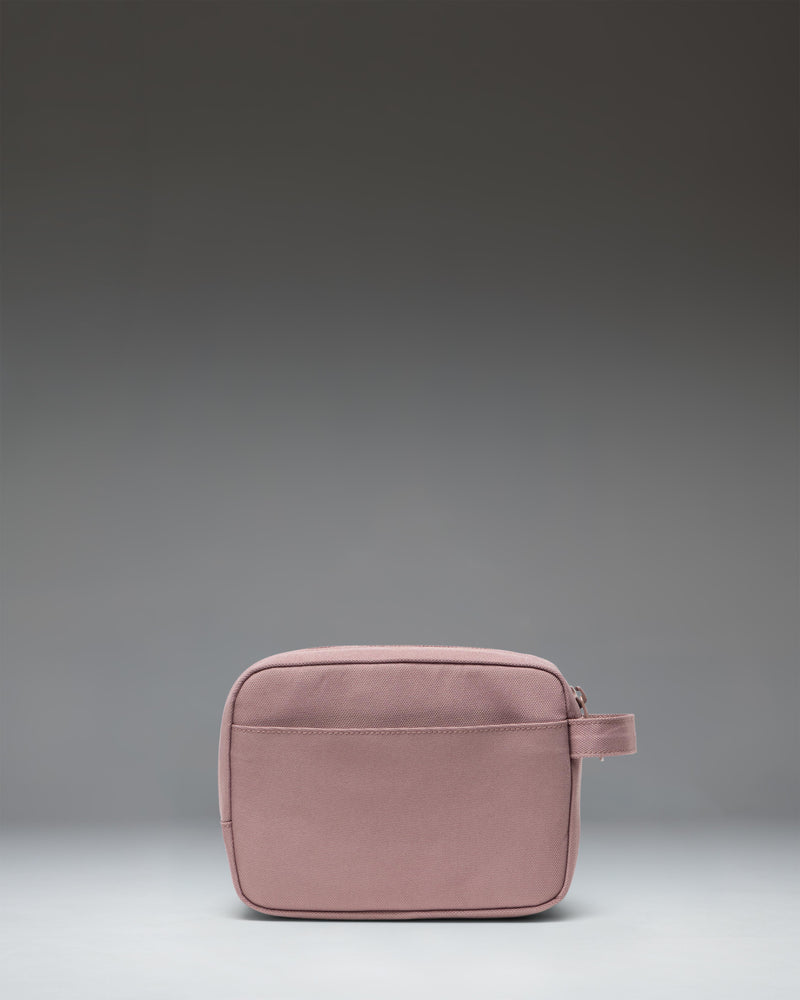 Herschel Supply Co. Anchor Organizer in Ash Rose, a dusty pink tech sleeve showing its clean, minimalist design and secure zipper closure.
