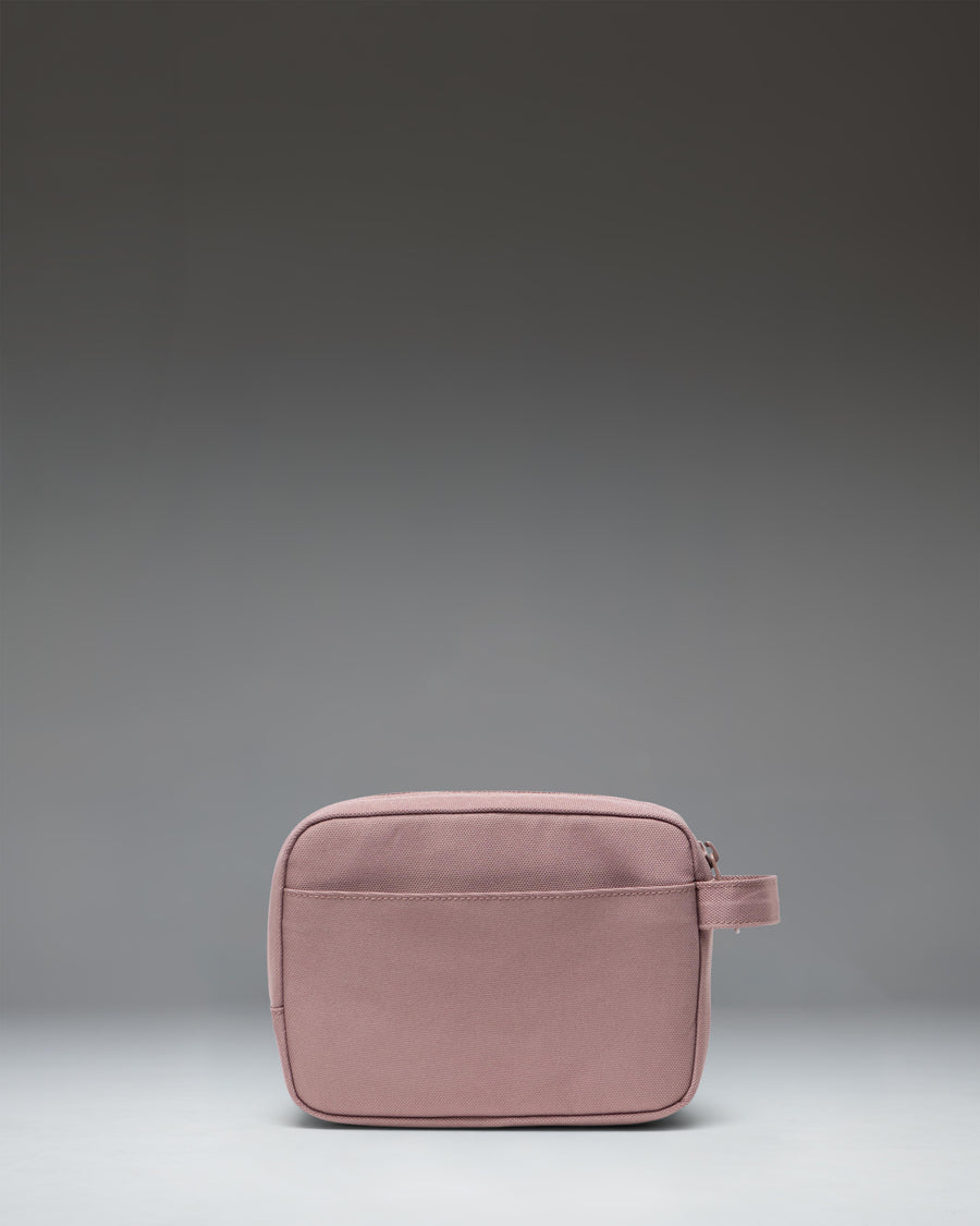 Herschel Supply Co. Anchor Organizer in Ash Rose, a dusty pink tech sleeve showing its clean, minimalist design and secure zipper closure.