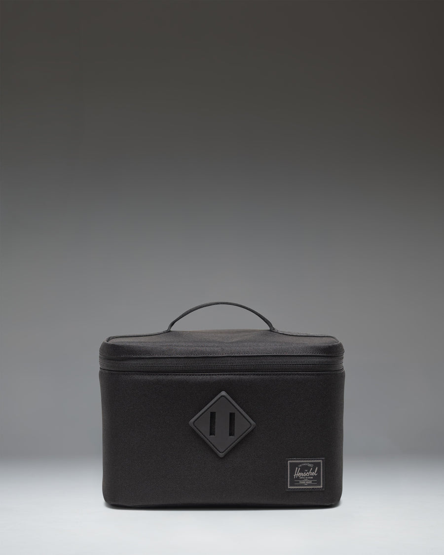 Black Herschel Heritage Lunch Box featuring a zippered front pocket and classic Herschel woven label.