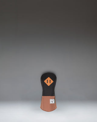 Herschel Supply Co. Heritage Fairway Wood Head Cover in black with a saddle brown base and a classic diamond accent detail.