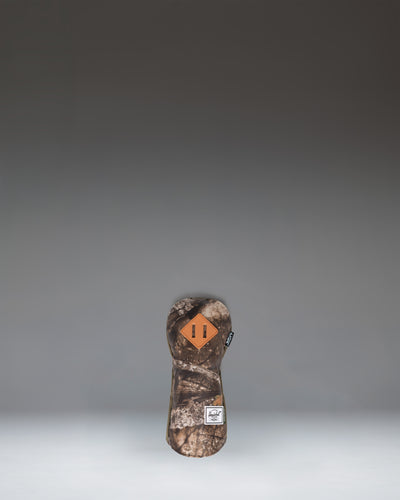Herschel Supply Co. Heritage Fairway Wood Head Cover in the Realtree APX camouflage pattern.