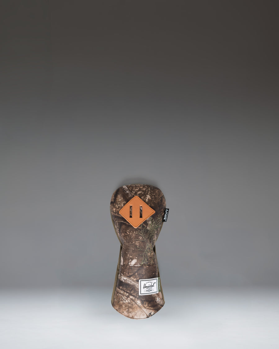 Herschel Supply Co. Realtree Heritage Hybrid Head Cover in Realtree APX Camo pattern.