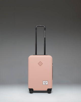 Herschel Heritage Hardshell Large CarryOn Luggage in Ash Rose pink.