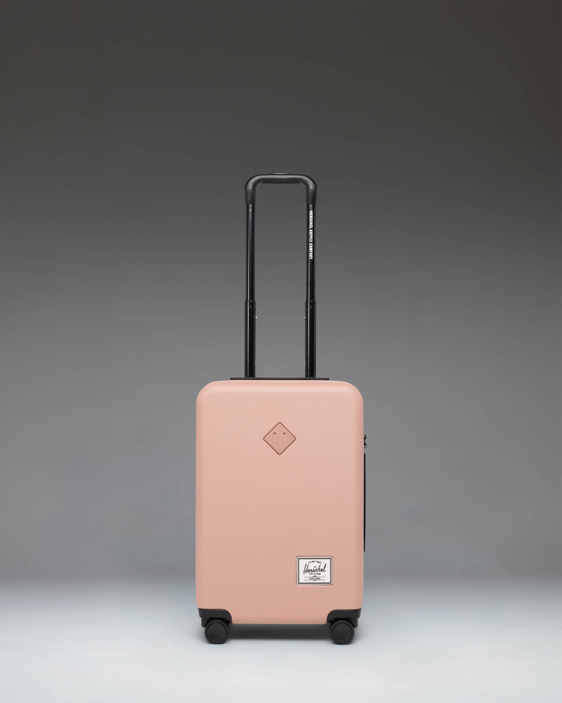 Herschel Heritage Hardshell Large CarryOn Luggage in Ash Rose pink.