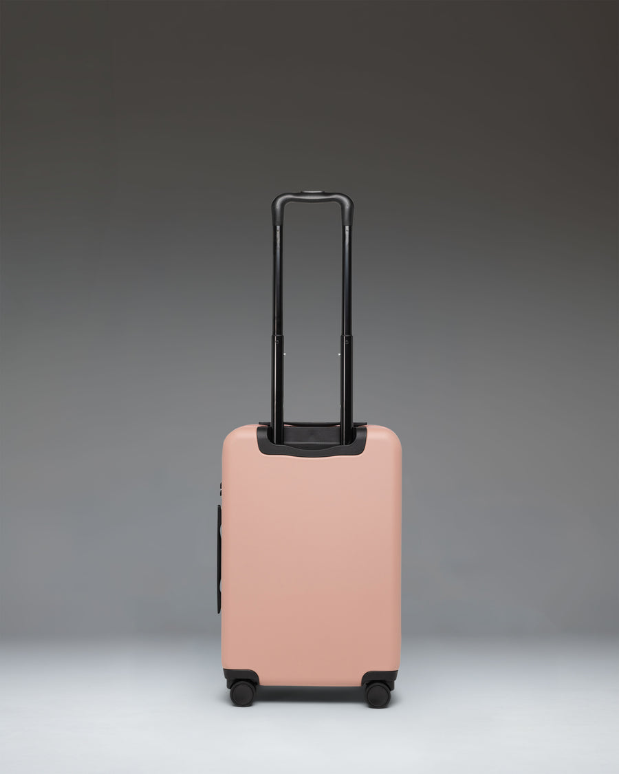 Herschel Heritage Hardshell Large Carry-On Luggage in Ash Rose pink color shown from the front.