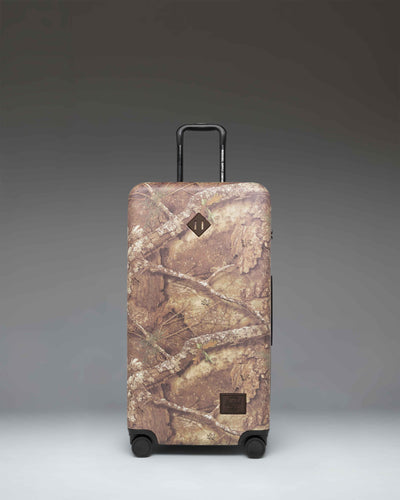 Realtree Herschel Heritage Large Luggage in Realtree APX Camo.