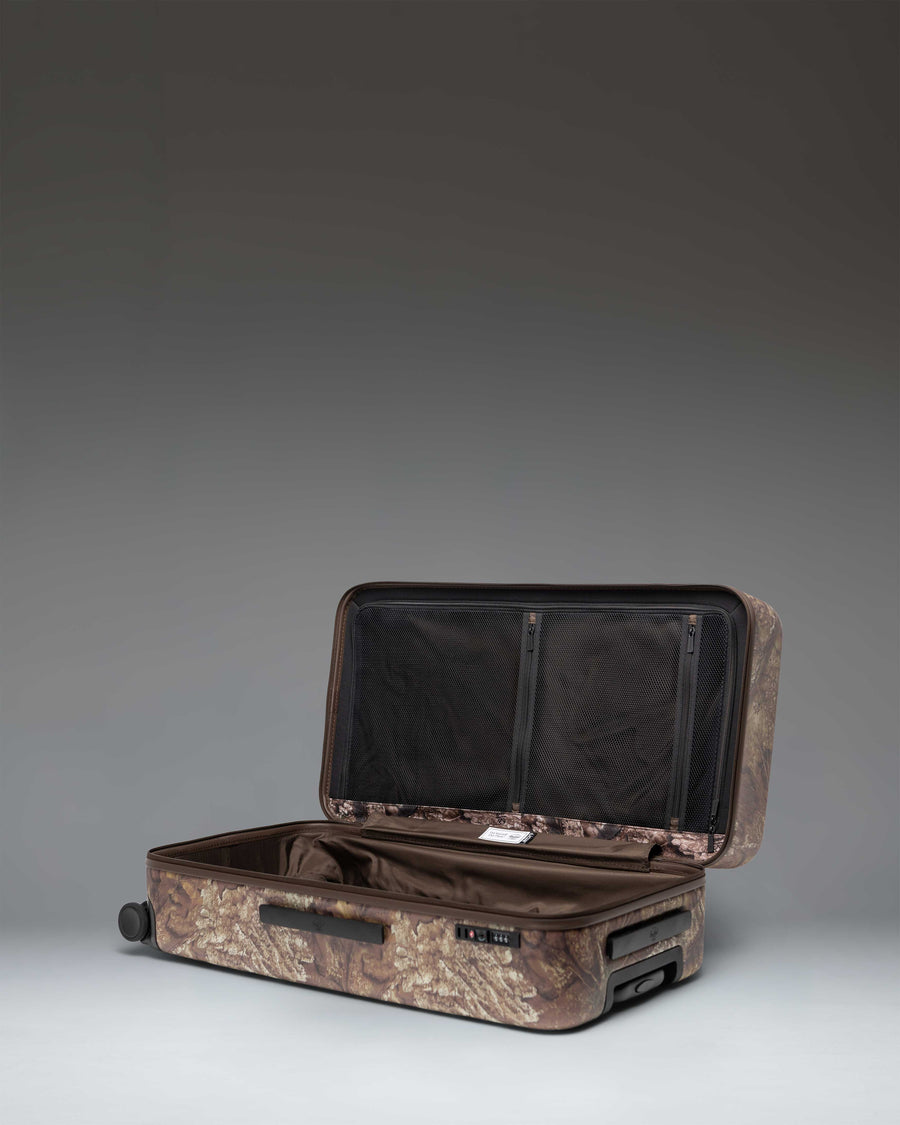 Herschel Heritage Large Luggage in Realtree APX Camo, showing a close-up detail of the durable fabric and zipper closure.