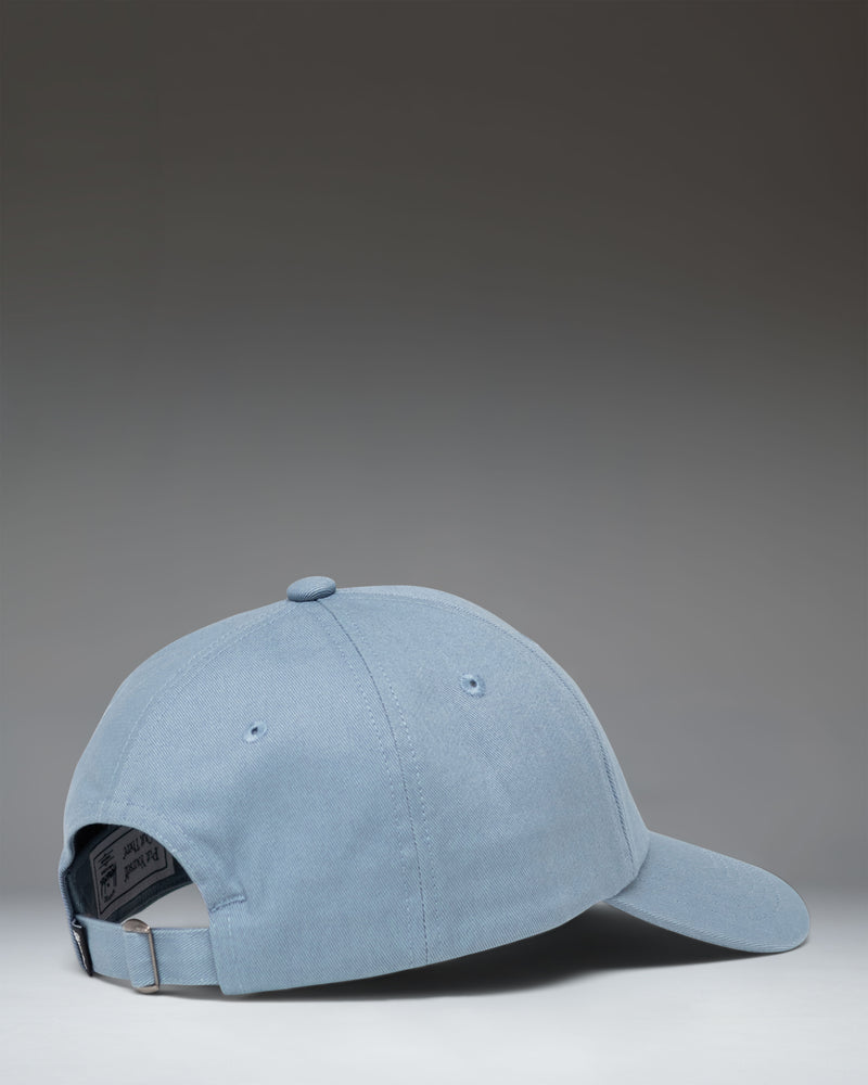 Herschel Supply Co. Sylas Classic Cap in Windward Blue, showing a side view of the adjustable strap and embroidered eyelets.