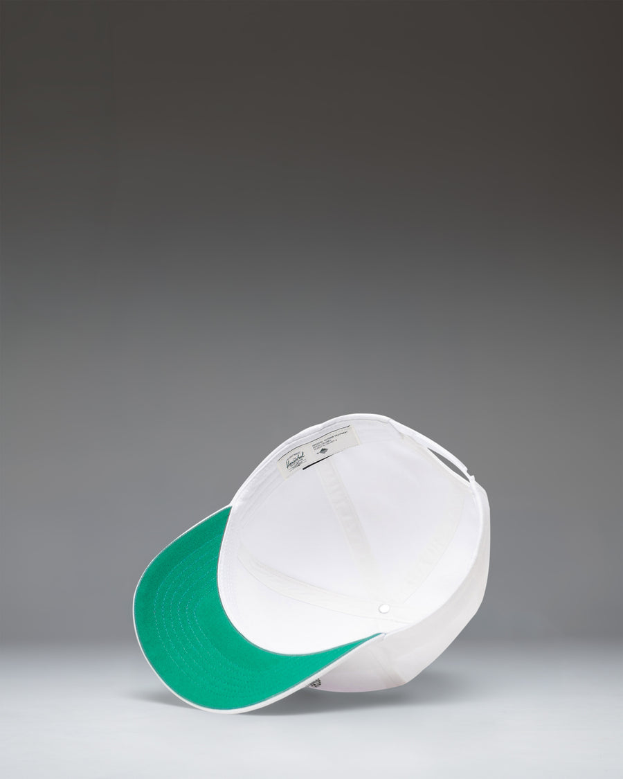White Herschel Supply Co Whaler Tall Cotton Paving Cap, side angle view.