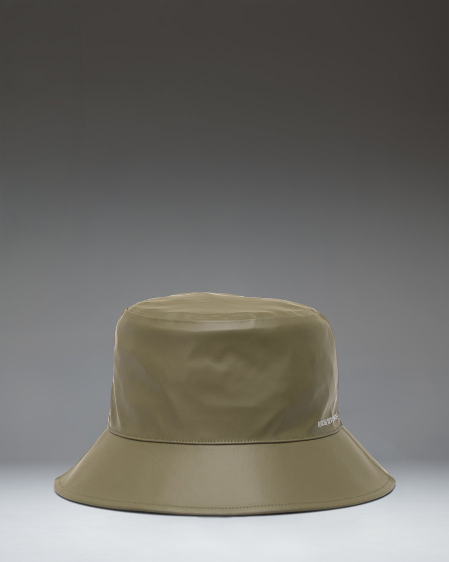 Herschel Supply Co. Norman Rain Bucket Hat in Ivy Green, showcasing a flat lay view of the waterproof fabric and wide brim.