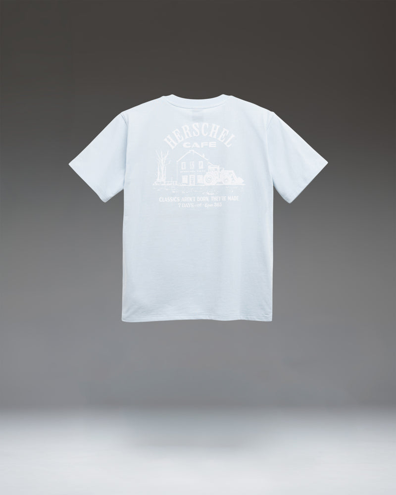 Herschel Supply Co. Cafe Tee Women's in Skyway, showing a light blue, relaxed-fit crewneck t-shirt.