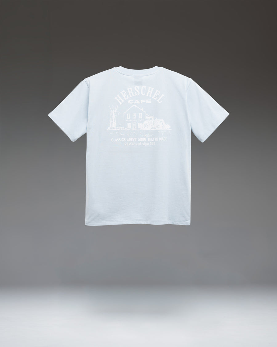 Herschel Supply Co. Cafe Tee Women's in Skyway, showing a light blue, relaxed-fit crewneck t-shirt.
