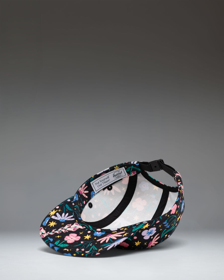 Herschel Supply Co. Glendale Kids Cap in Enchanted Garden floral print, shown from the side.