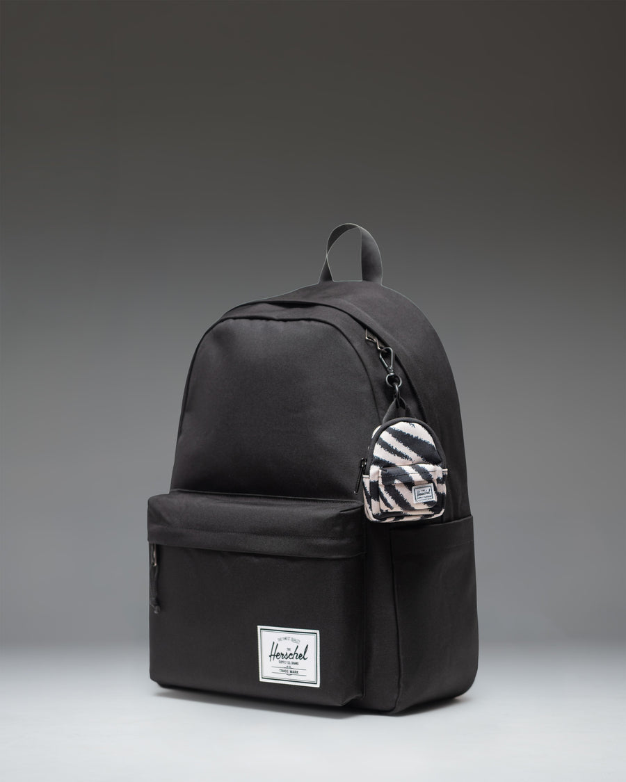 Herschel Classic Backpack Bag Charm in Zebra stripe pattern.