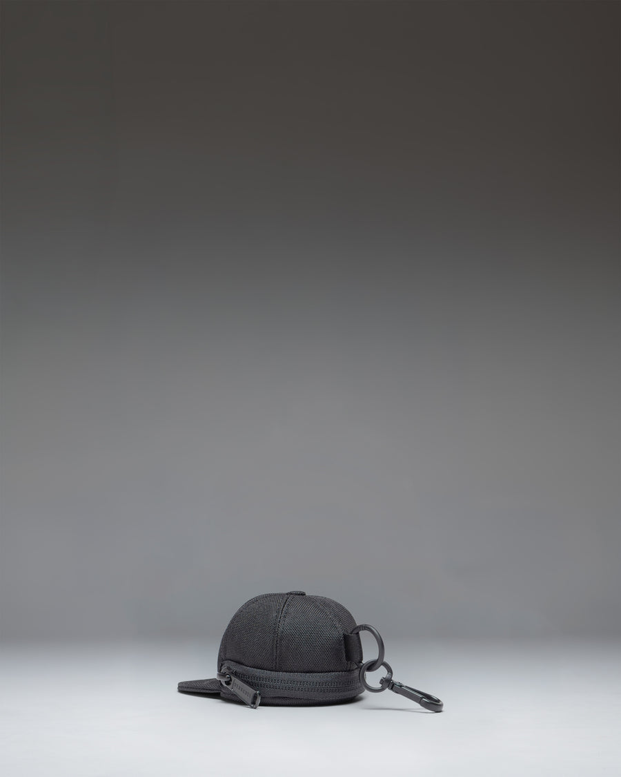 Black Herschel Supply Co Sylas Classic Cap Bag Charm.