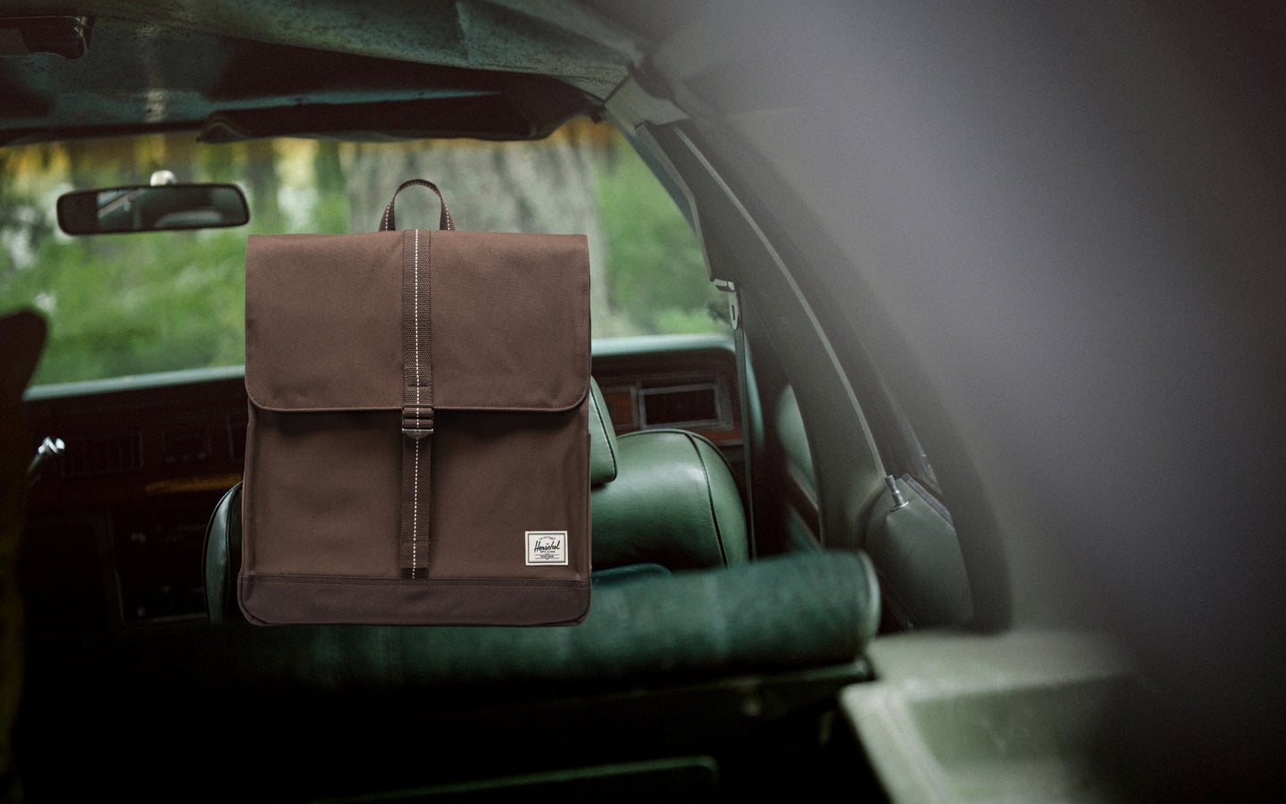 Herschel Supply Co. City Backpack in Brown Slate/Delicioso shown from the front on a desktop view.