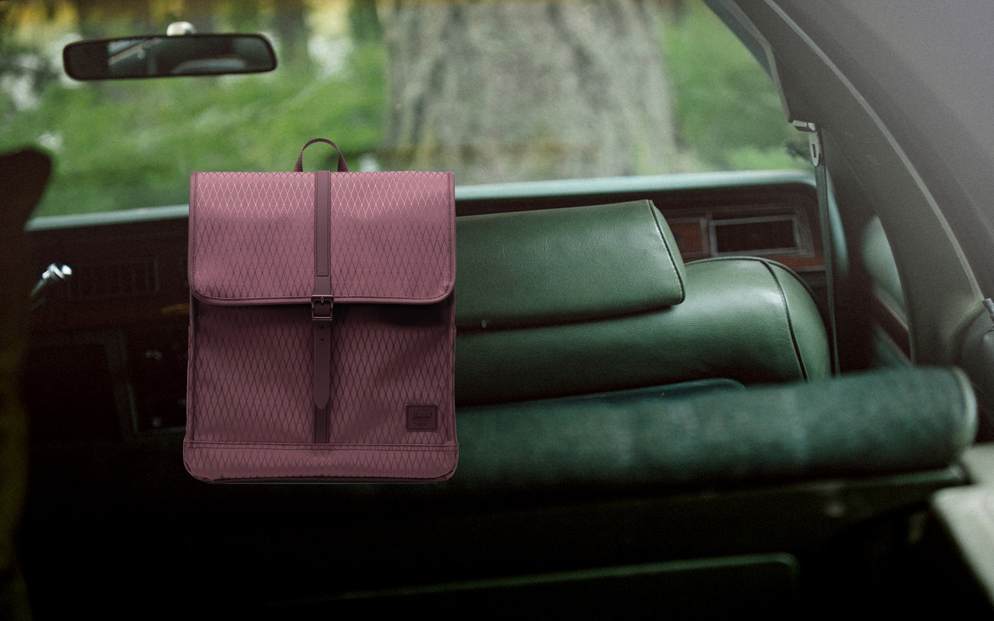 Herschel Supply Co. City Backpack in Huckleberry Diamond color, shown from a front angle.