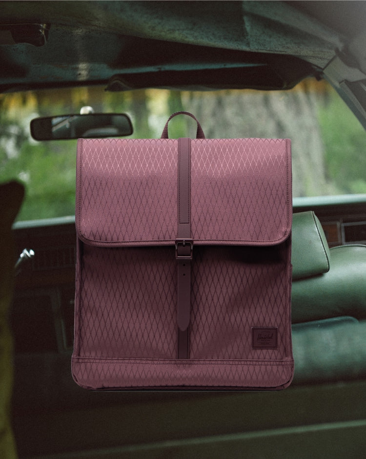 Herschel Supply Co. City Backpack in Huckleberry Diamond color, shown from the front.