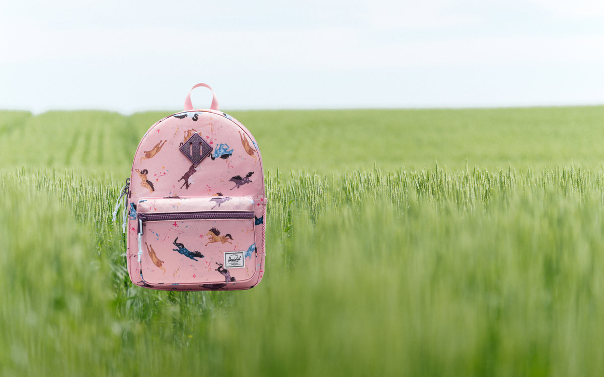 Herschel Heritage Kids Backpack in Wild Horses pattern, featuring a running horse print design.