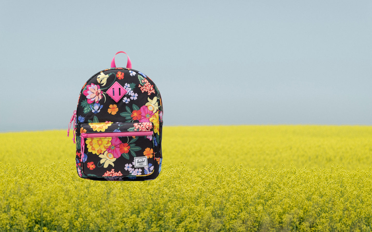 Herschel Heritage Kids Backpack in Paper Garden floral print, shown on a white background.