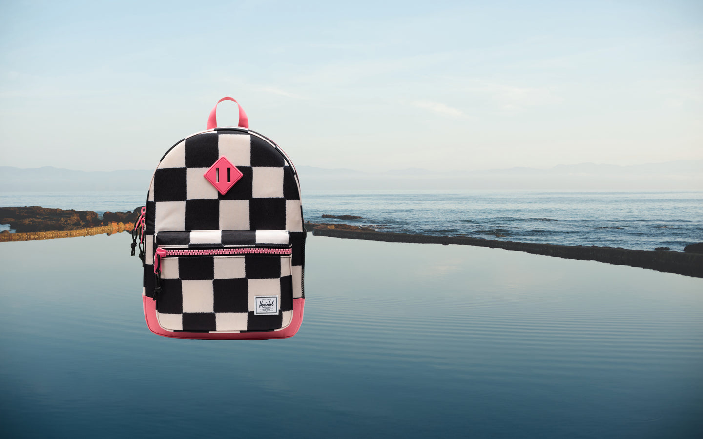 Herschel Heritage Kids Backpack in the colorful Check This Confetti checkered pattern.