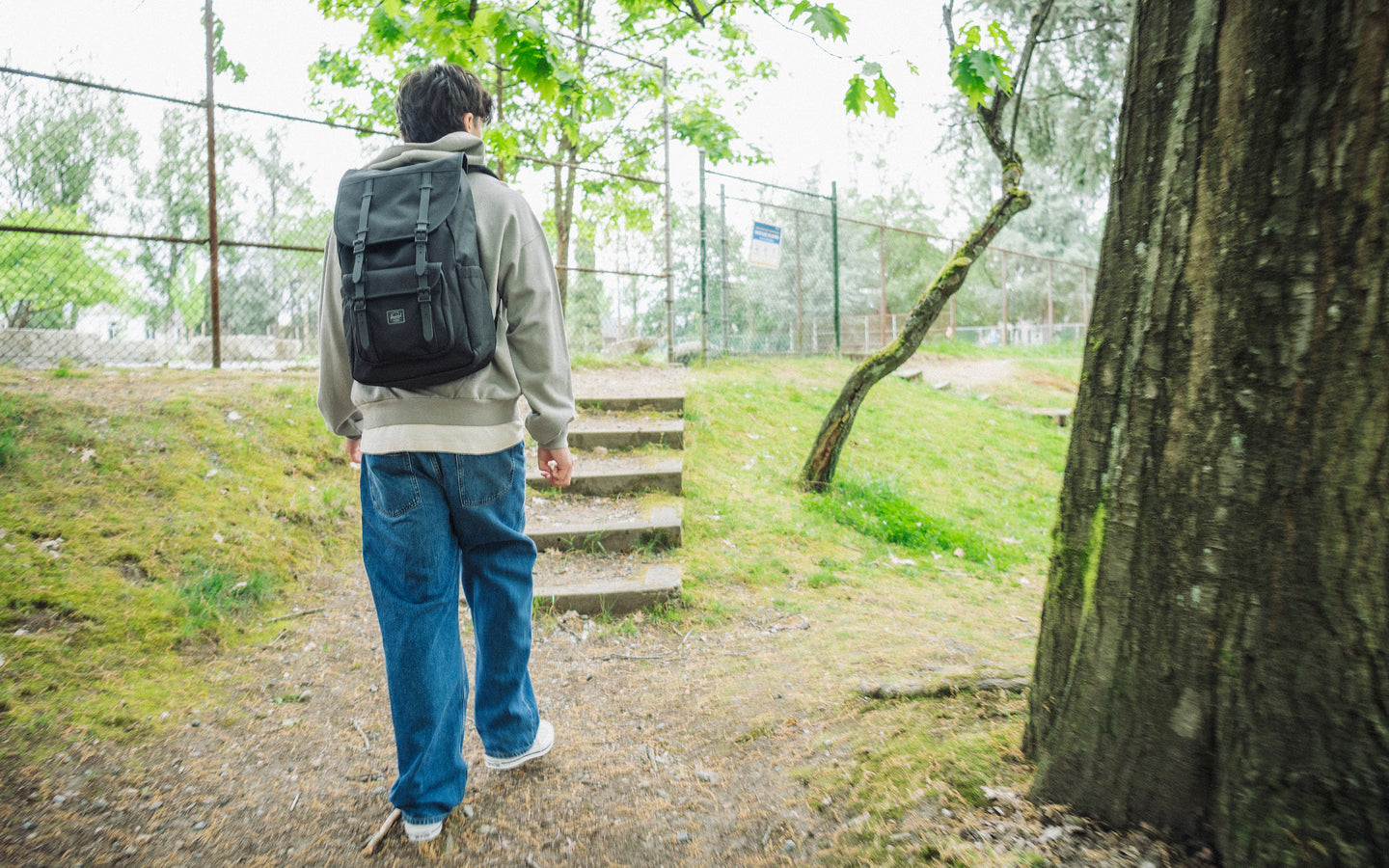 Herschel Little America Backpack in Black Tonal shown from the front, highlighting its classic mountaineering design and tonal buckle straps.