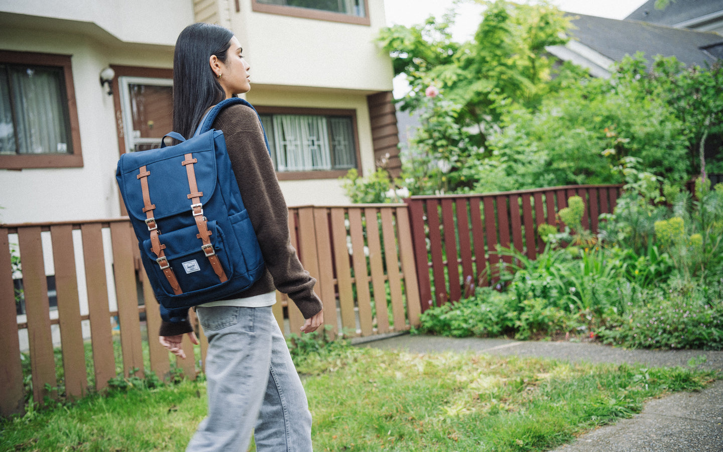 Herschel Little America Mid Backpack in classic Navy blue, featuring a clean design with dual magnetic strap closures.