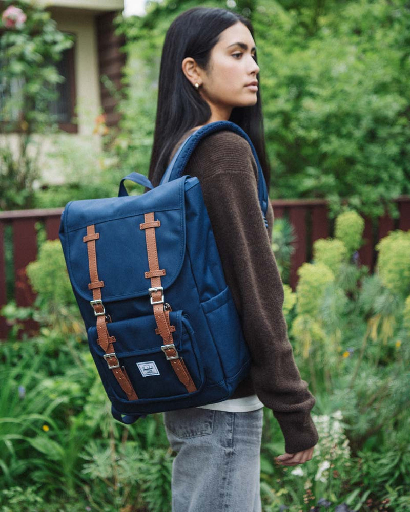Herschel Little America Mid Backpack in Navy, featuring a classic mountaineering design with dual brown rubber straps.