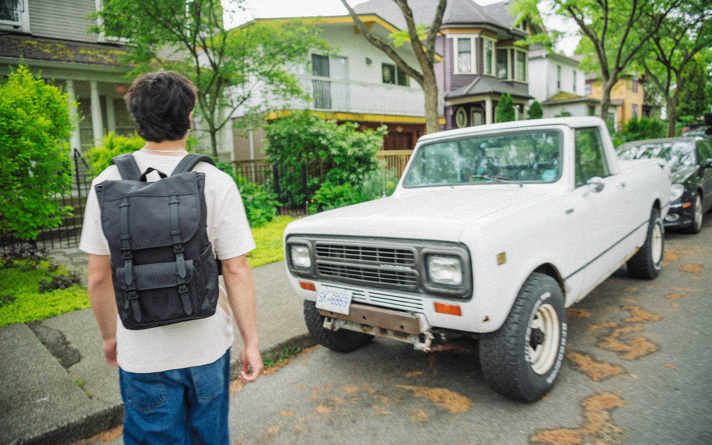 Herschel Little America Mid Backpack in Black Diamond/Black featuring a classic dual-strap design with black buckles and a front storage pocket.