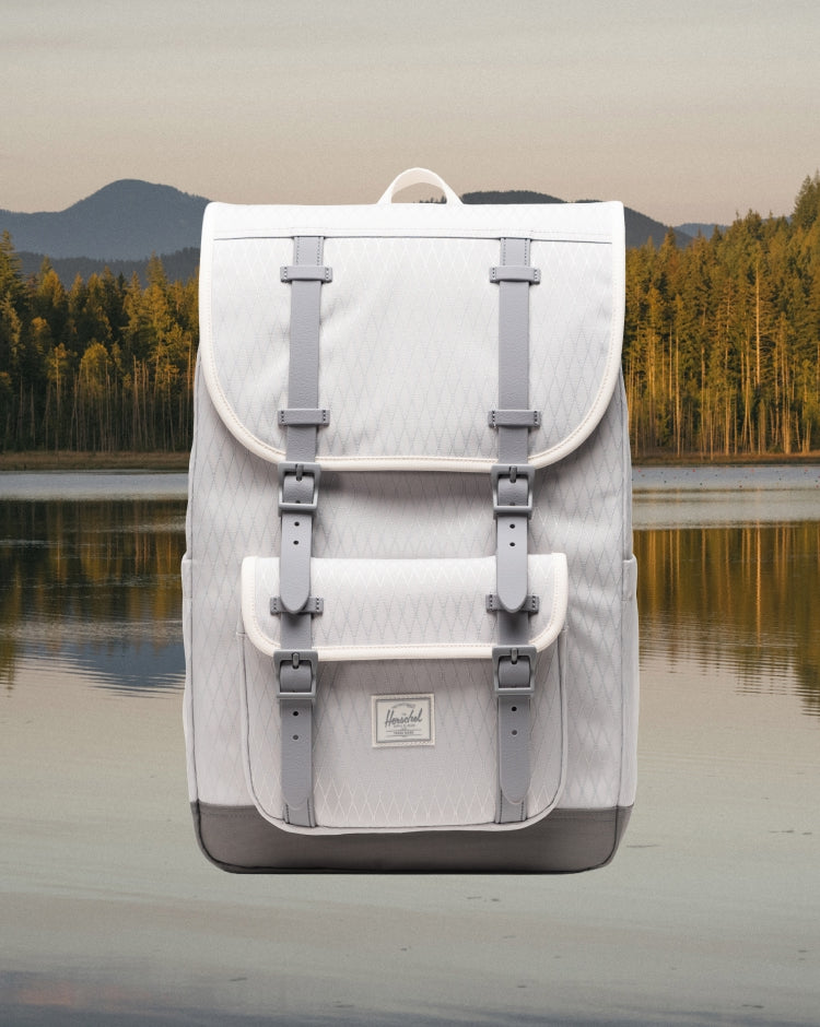 Herschel Little America Mid Backpack in Vapor Diamond and Charcoal Gray with front pocket and buckle straps.
