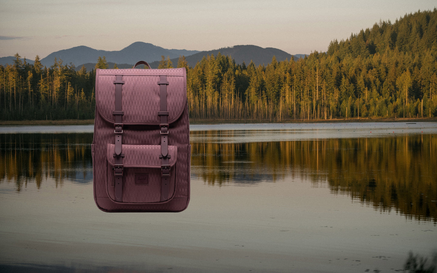 Herschel Supply Co. Herschel Little America Mid Backpack in Huckleberry Diamond, a dark teal blue-green, shown as a lifestyle hero shot.