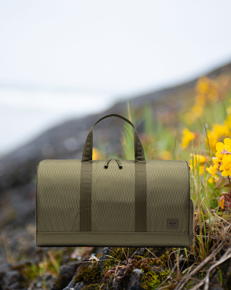 Herschel Novel Duffle bag in Ivy Green Diamond.