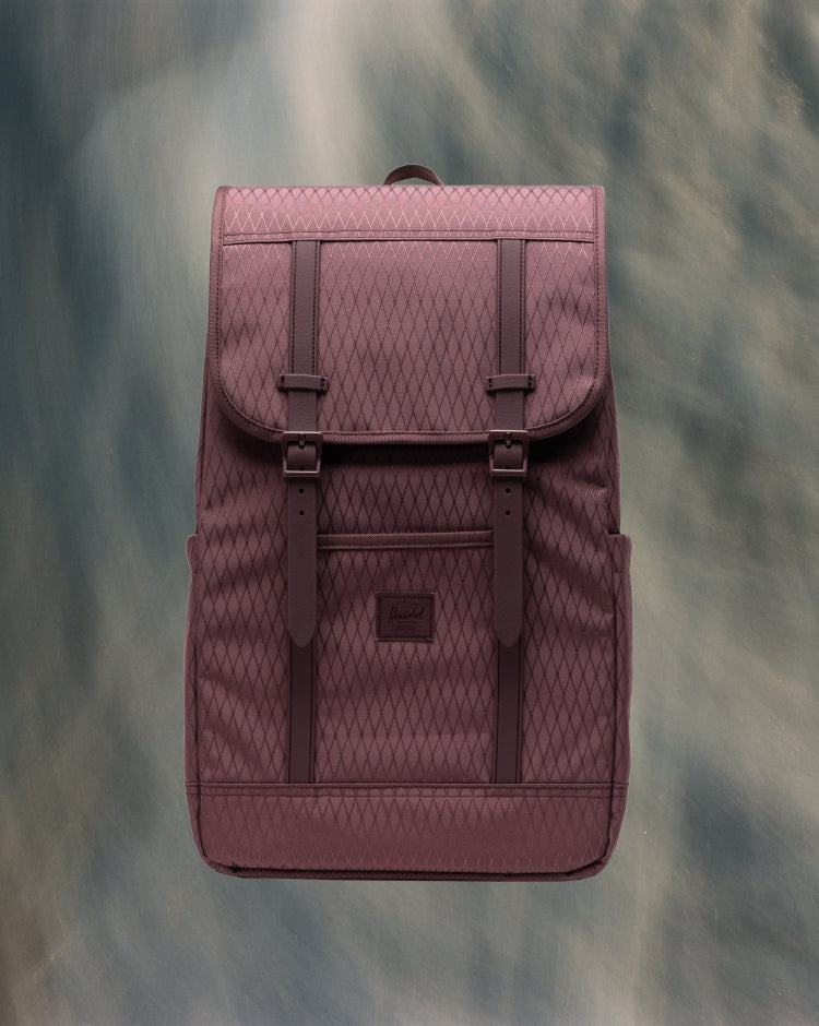 Herschel Retreat Backpack in Huckleberry Diamond color, showcasing a front-facing mobile view of the stylish and durable everyday bag.