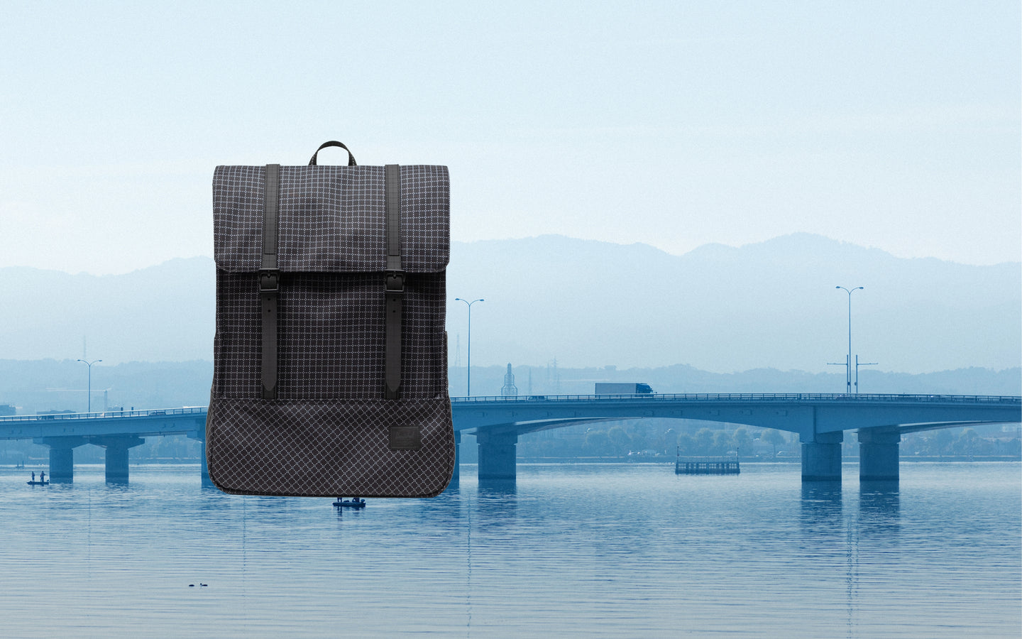 Herschel Survey Backpack in Grid - Black displayed on a desktop background.